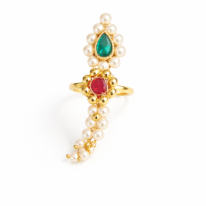 Pearl Nath finger ring featuring red and green stones with pearl detailing on a cream background