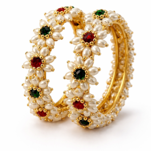 Parijatak pearl floral bangles with green and red stones in gold finish.