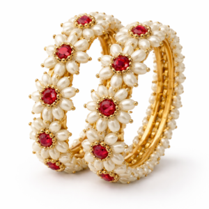 Pair of Parijatak pearl floral bangles with red stone centers on a white background