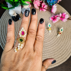 Nath Finger Ring – Pink & Green Nath Finger Ring - Pink & Green worn on a hand, showing white bead details, a pink teardrop accent, and a green centre stone.